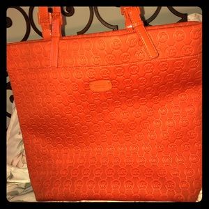 Bright orange Michael Kors bag